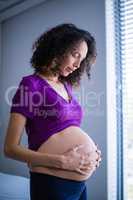 Pregnant woman standing in ward
