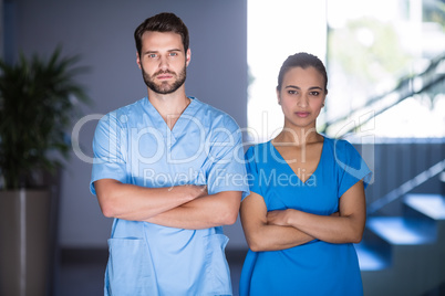 Portrait of doctors standing with arms crossed