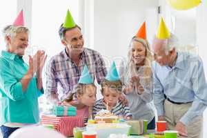 Happy multi- generation family celebrating a birthday