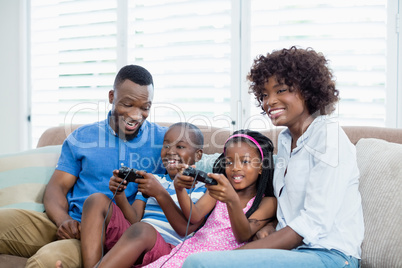 Happy family playing video game