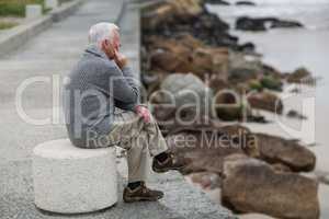 Senior man sitting on the steps