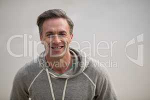 Smiling mature man standing on the beach