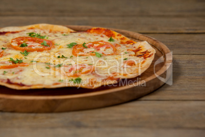 Delicious italian pizza served on pizza tray