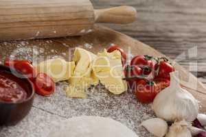 Pizza dough, flour, rolling pin, with ingredient