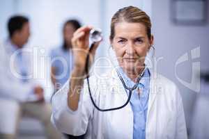 Portrait of female doctor holding stethoscope