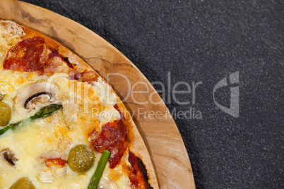 Italian pizza served on wooden board