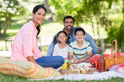 Happy family enjoying together in park