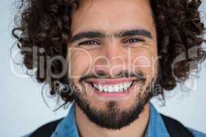 Happy male photographer in studio