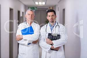 Portrait of doctors standing together with clipboard