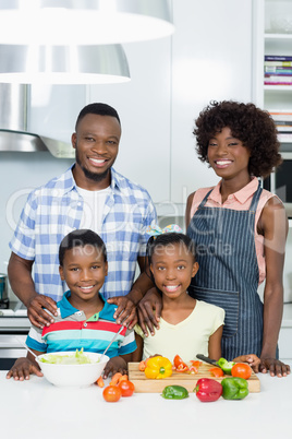 Parents and Kids standing in kitchen at home