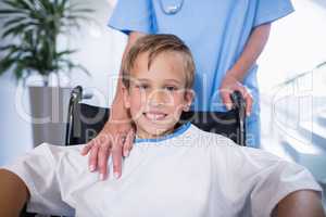 Portrait of smiling disable boy in wheelchair