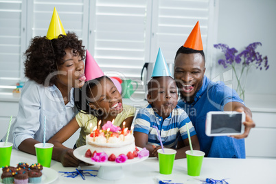 Happy family celebrating birthday party at home