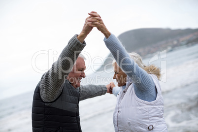 Senior couple having fun together at beach