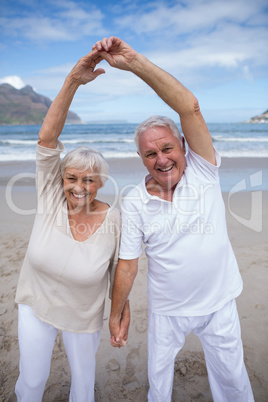 Senior couple having fun together at beach