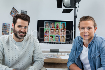 Photographers working at desk