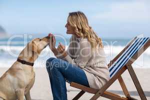 Mature woman petting her dog