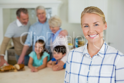 Beautiful woman standing at kitchen