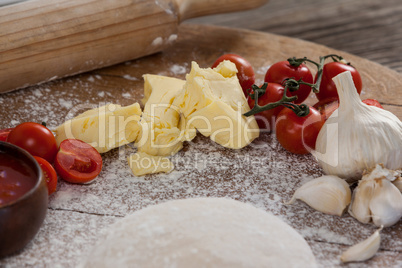 Pizza dough, flour, rolling pin, with ingredient