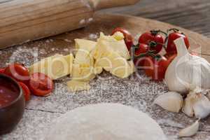 Pizza dough, flour, rolling pin, with ingredient