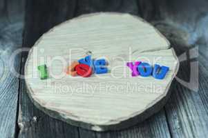 inscription of the small colored wooden letters I love you