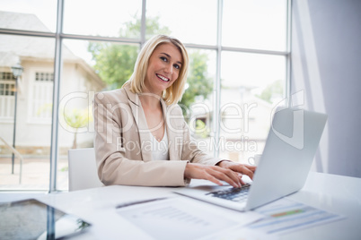 Businesswoman using laptop