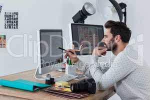 Photographer working on desktop pc