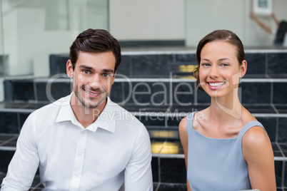 Cheerful business executives at conference centre