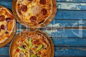 Various delicious italian pizza served on pizza tray