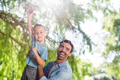 Father having fun with his son in park