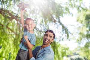 Father having fun with his son in park