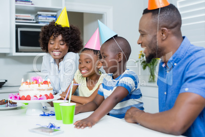 Family celebrating birthday party at home