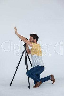 Photographer clicking picture using digital camera