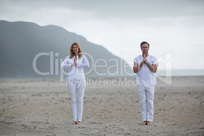 Mature couple doing meditation