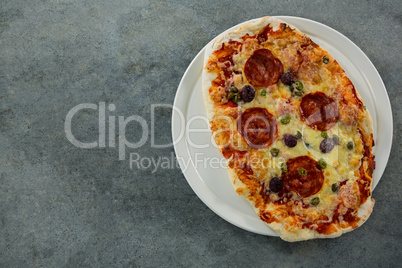 Italian pepperoni pizza served on a pizza tray