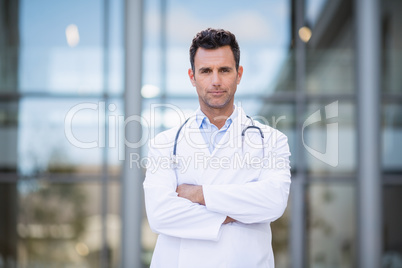 Doctor standing with arms crossed Doctor standing with arms crossed