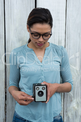 Female photographer with old fashioned camera