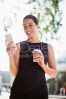 Happy businesswoman talking on mobile phone