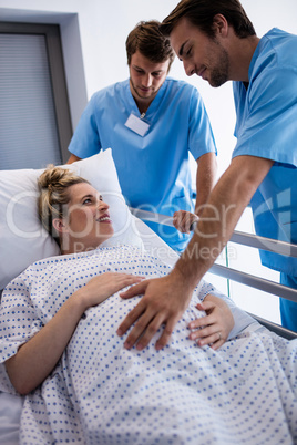 Doctors examining pregnant woman