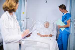 Doctors talking to a senior patient