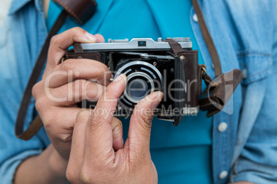 Female photographer with old fashioned camera