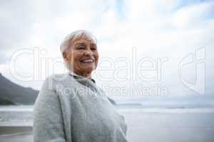 Portrait of senior woman standing on the beach