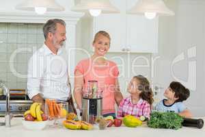 Parents interacting with their kids in kitchen