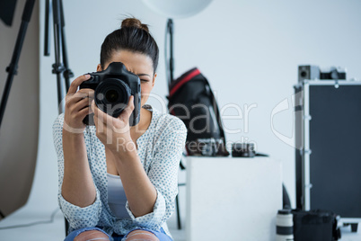 Female photographer with digital camera