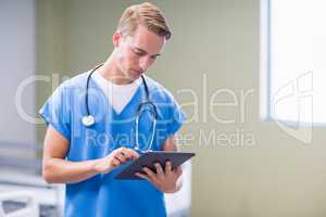 Doctor using digital tablet