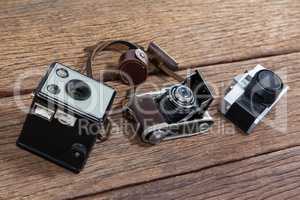 Close-up of old fashioned cameras on table