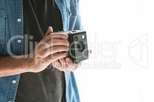 Mid section of male photographer with old fashioned camera