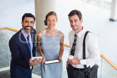 Business executives holding digital tablet Business executives holding digital tablet