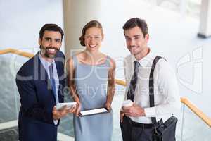 Business executives holding digital tablet