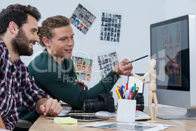 Photographers working at desk