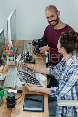 Photographers working at desk